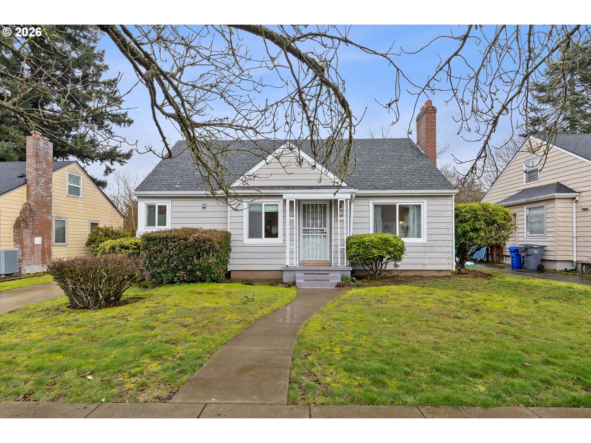 4773 North Yale Street Portland, OR 97203 - Photo 1 of 45 a front view of a house with a garden and yard