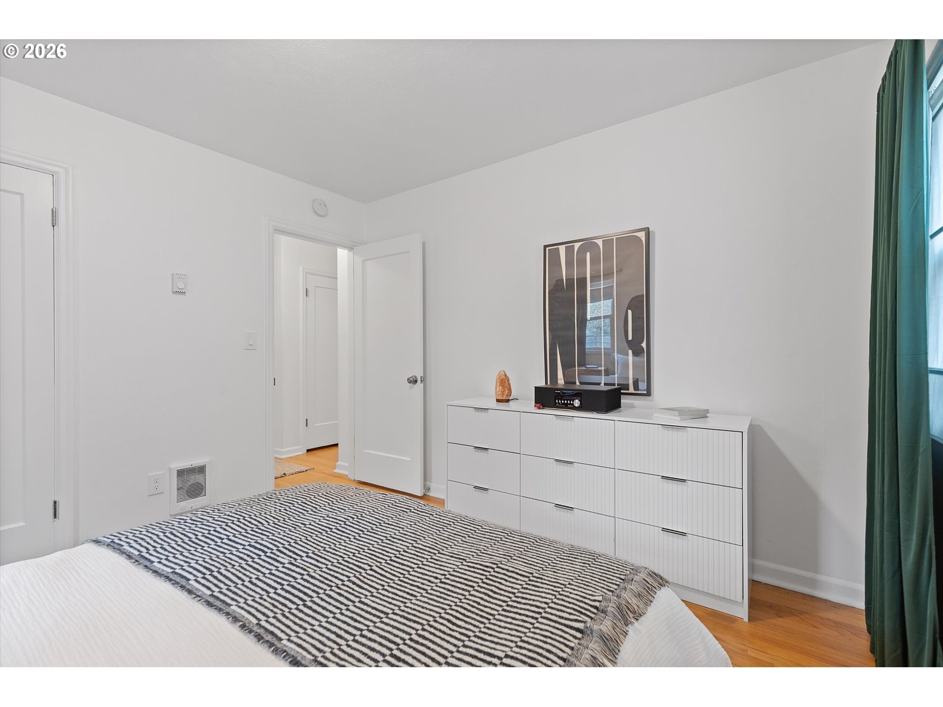 4773 North Yale Street Portland, OR 97203 - Photo 13 of 45 a room with a bed and a dresser