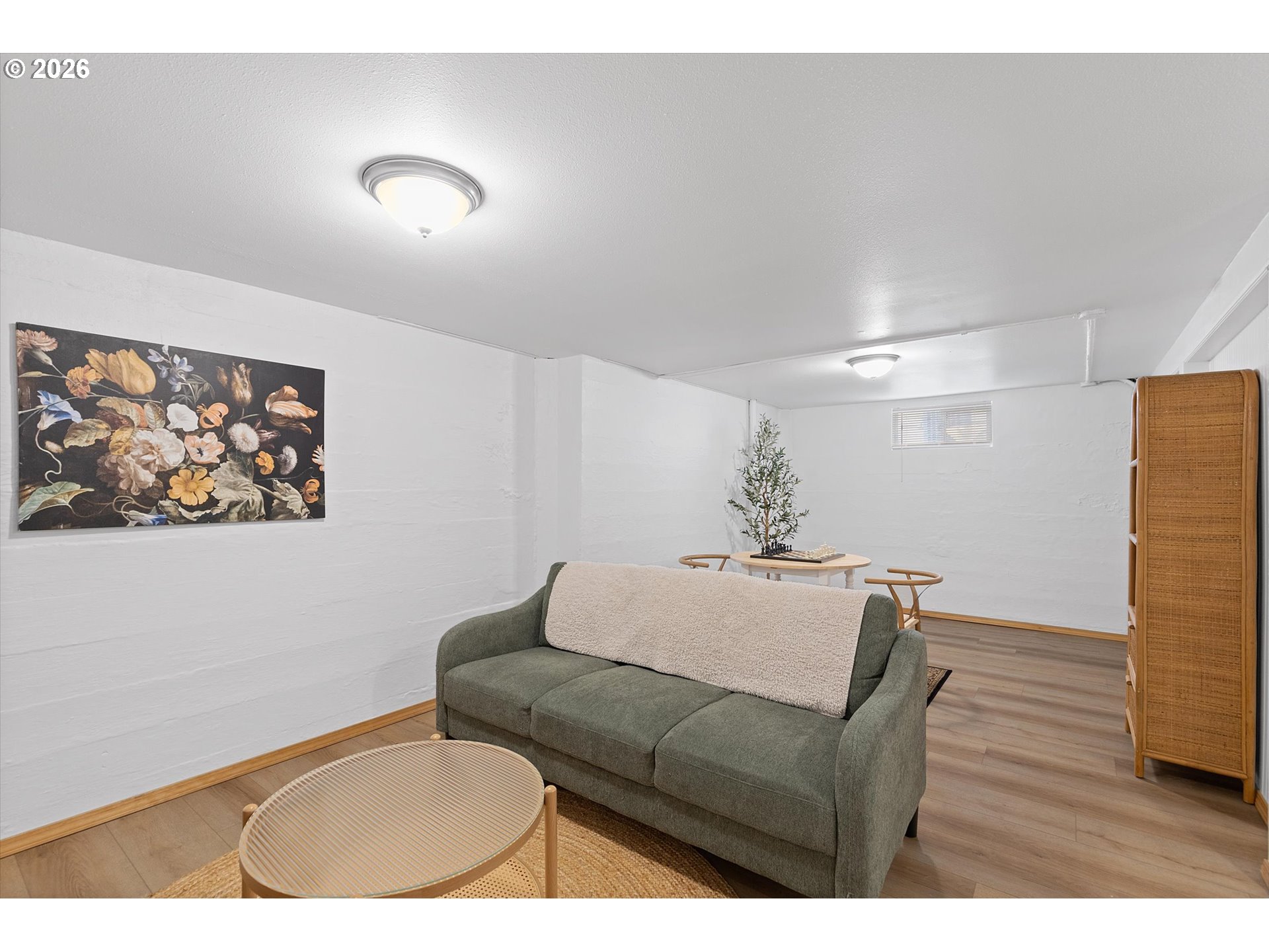 4773 North Yale Street Portland, OR 97203 - Photo 24 of 45 a living room with furniture and wooden floor