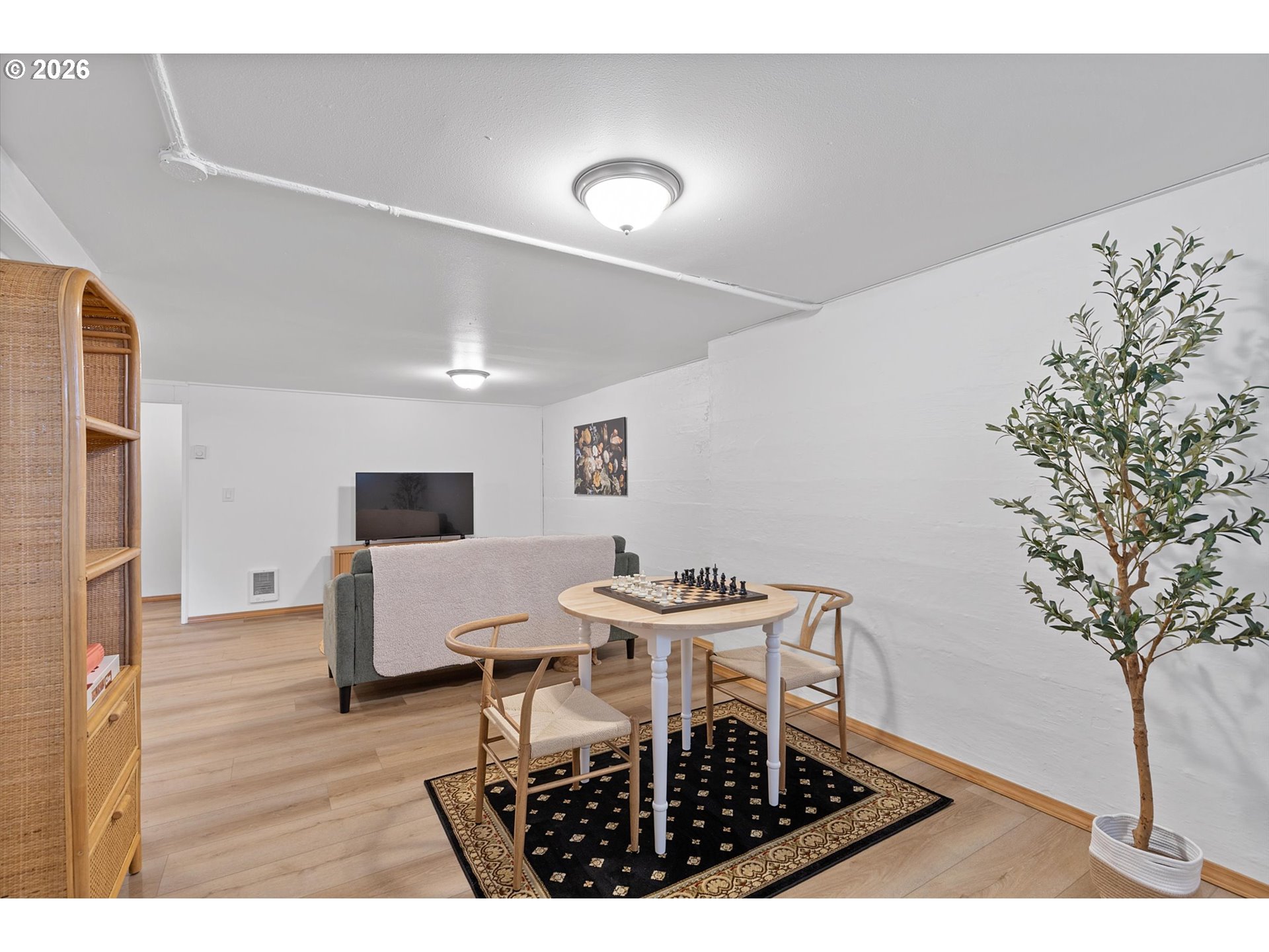 4773 North Yale Street Portland, OR 97203 - Photo 26 of 45 a living room with furniture and a potted plant