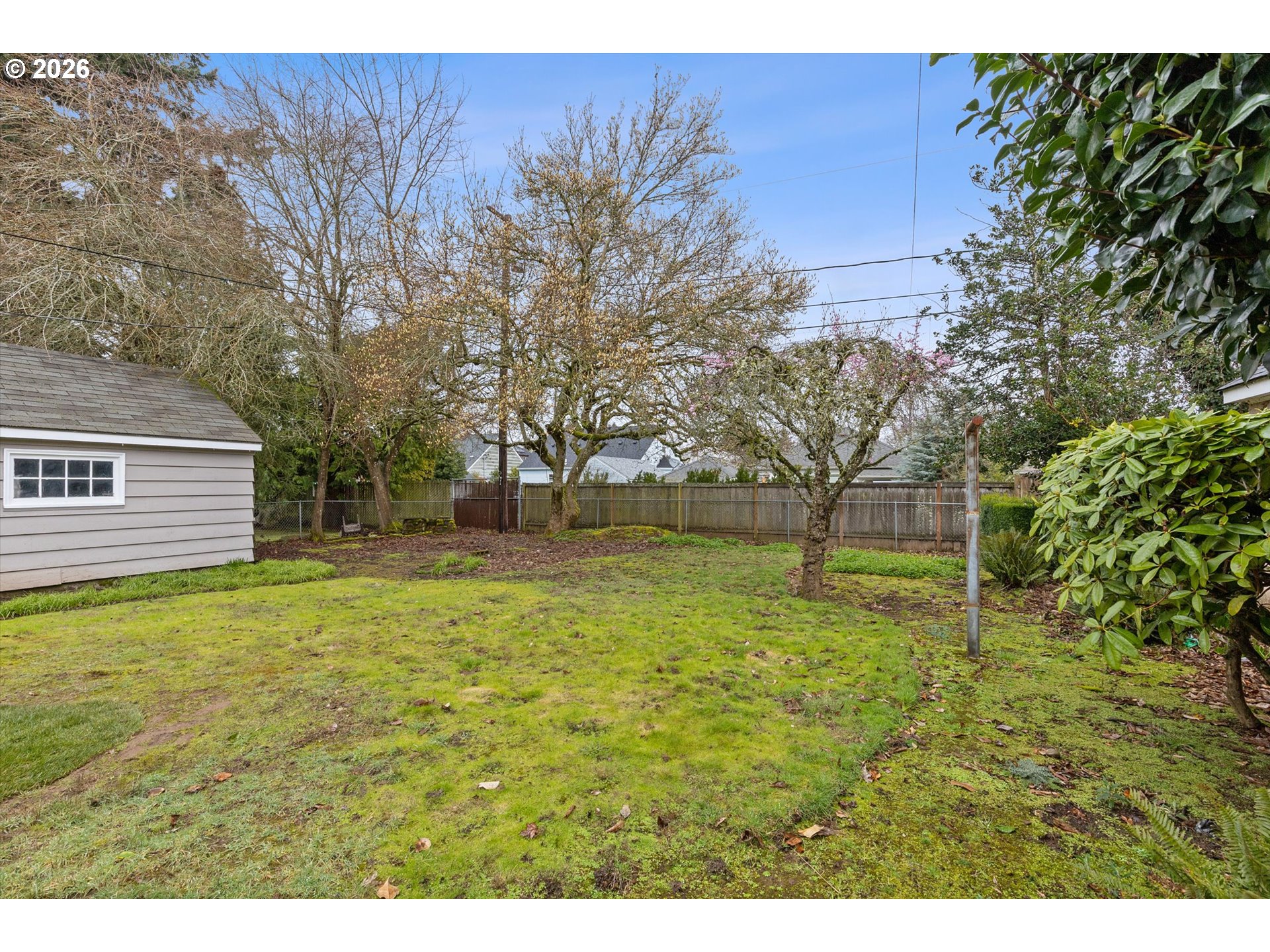 4773 North Yale Street Portland, OR 97203 - Photo 38 of 45 a backyard of a house with lots of green space