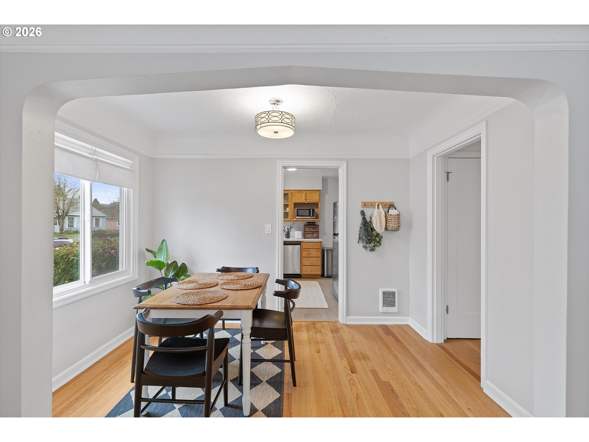 4773 North Yale Street Portland, OR 97203 - Photo 8 of 45 a view of a dining room with furniture and wooden floor