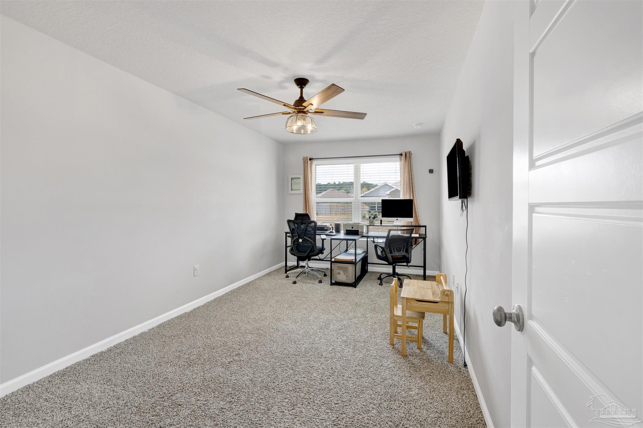 9747 MilleeLoop Loop Pensacola, FL 32526 - Photo 20 of 31 a view of a workspace with furniture and a window