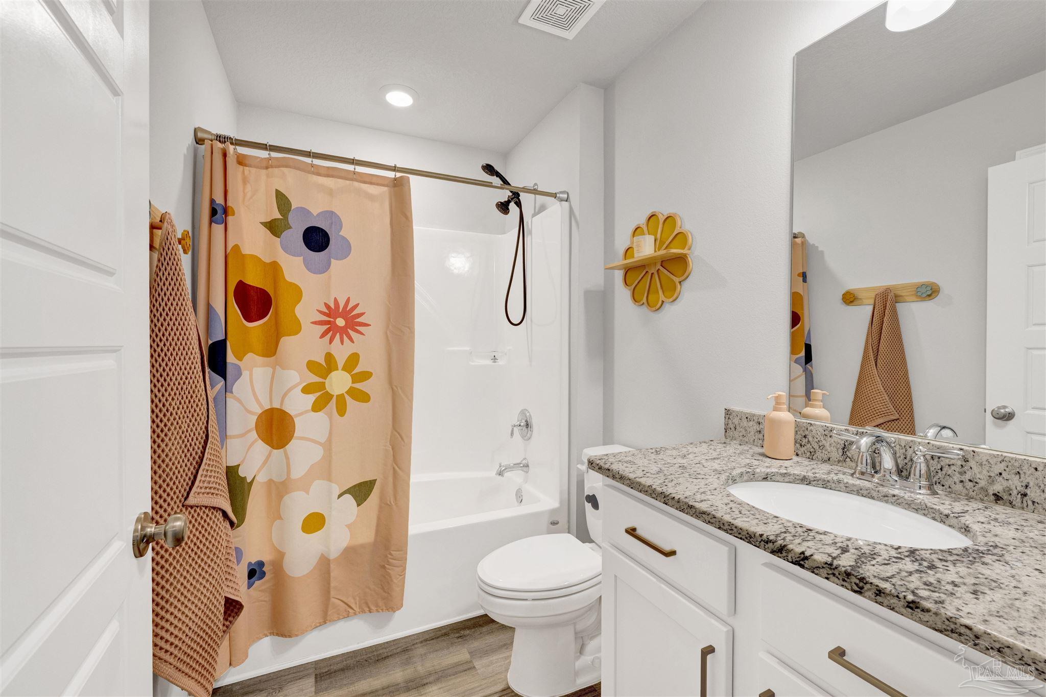 9747 MilleeLoop Loop Pensacola, FL 32526 - Photo 21 of 31 a bathroom with a granite countertop sink toilet and shower