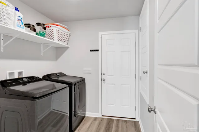 a view of a door and utility in a room