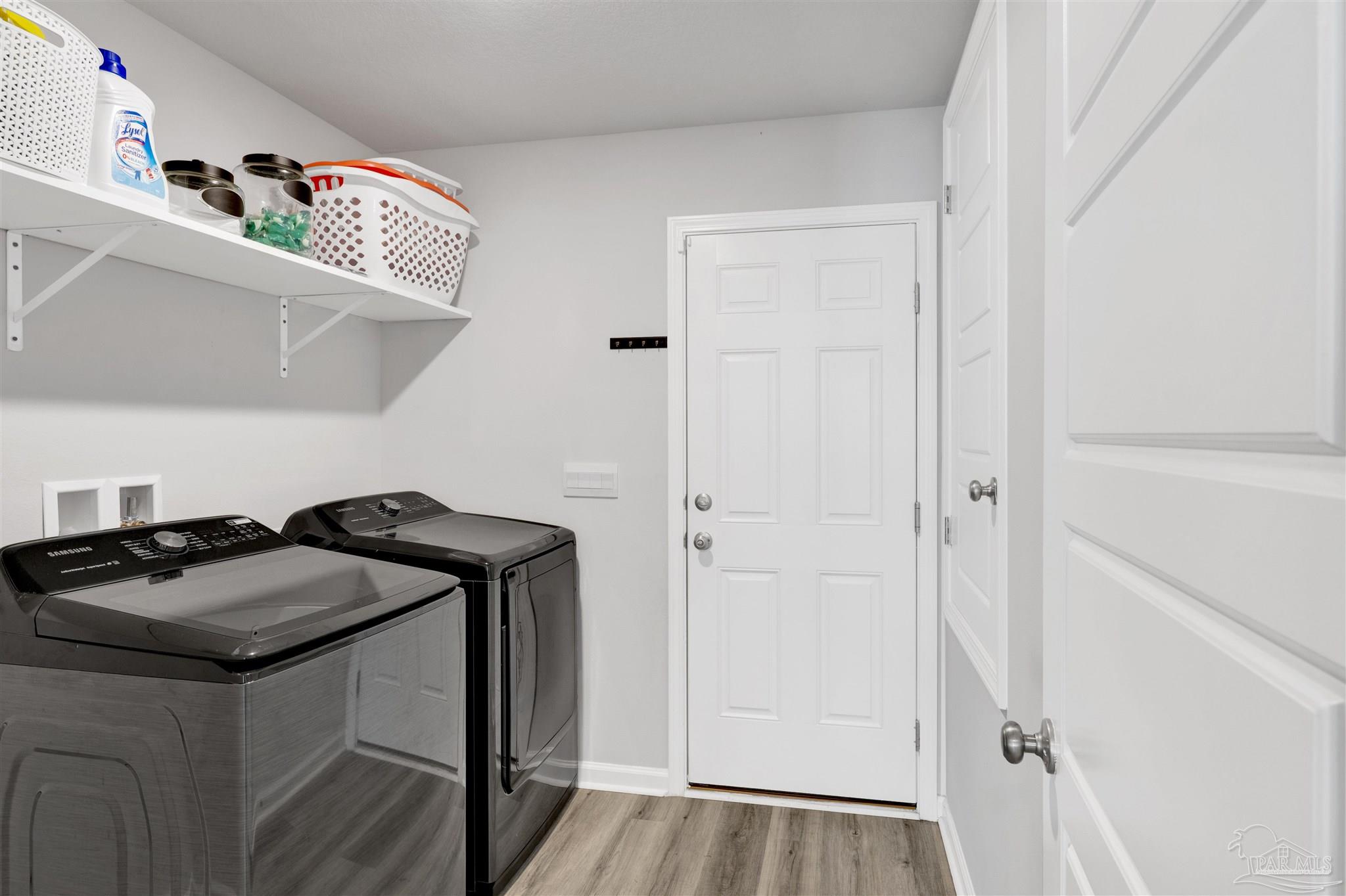 9747 MilleeLoop Loop Pensacola, FL 32526 - Photo 23 of 31 a view of a door and utility in a room