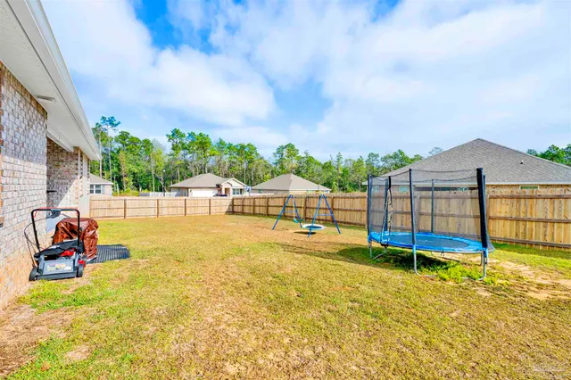 a view of a swimming pool with an outdoor seating
