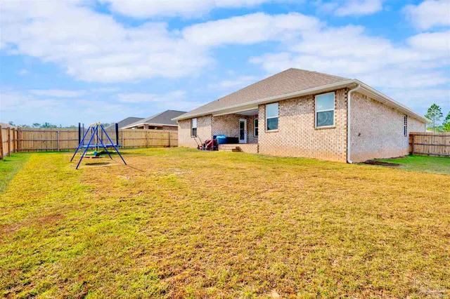 a view of a swimming pool with an outdoor seating
