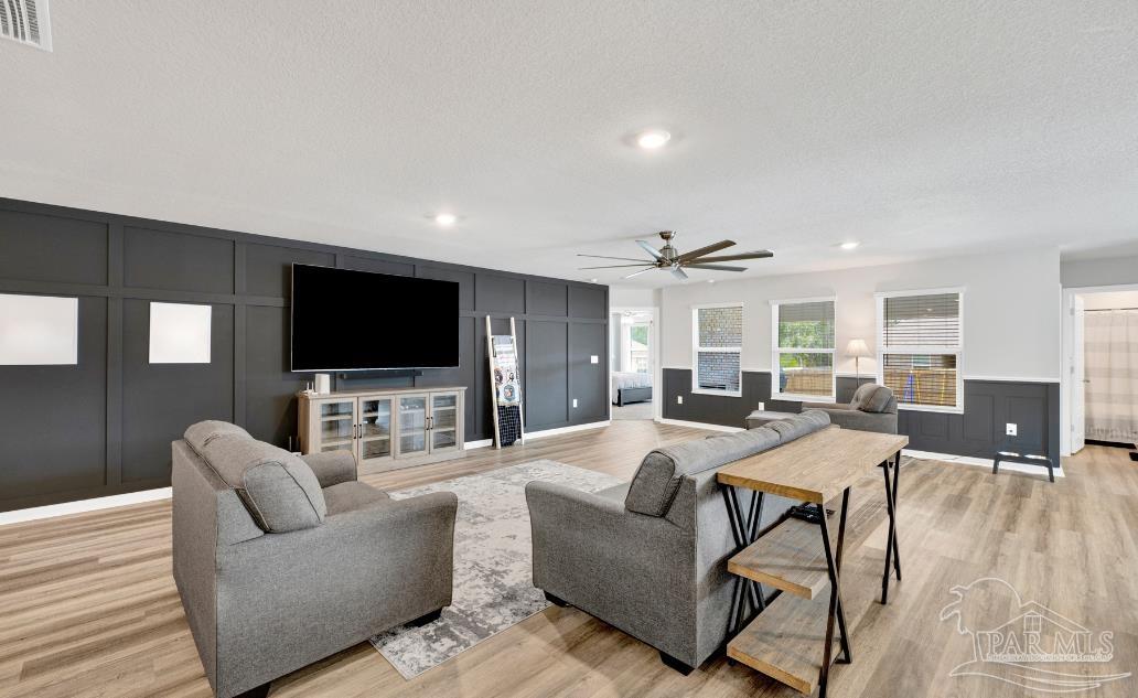 9747 MilleeLoop Loop Pensacola, FL 32526 - Photo 4 of 31 a living room with furniture and a flat screen tv