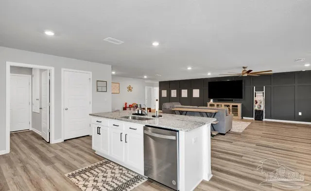 a kitchen with a stove and a refrigerator