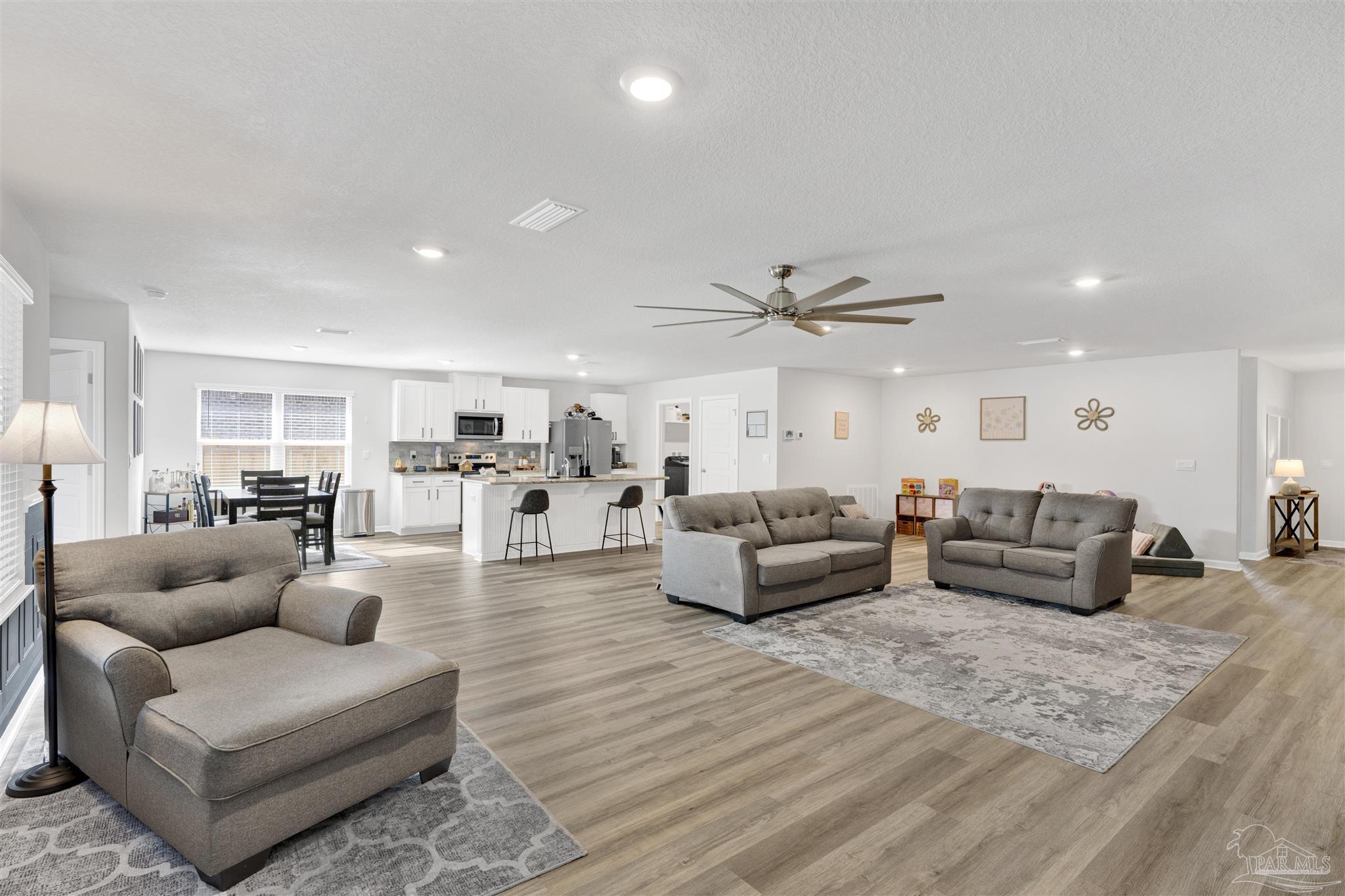 9747 MilleeLoop Loop Pensacola, FL 32526 - Photo 6 of 31 a living room with furniture and view of kitchen