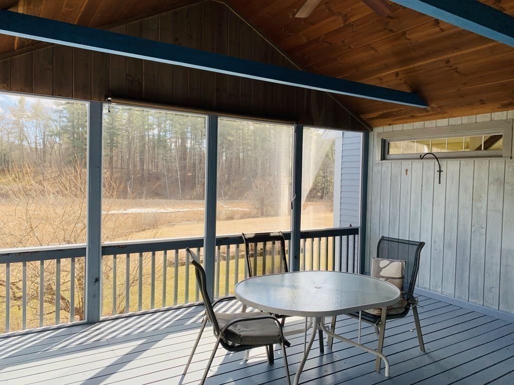 272 Lowell Road Groton, MA 01450 - Photo 11 of 21 a view of a porch with furniture and wooden floor