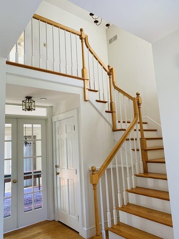 272 Lowell Road Groton, MA 01450 - Photo 4 of 21 a view of staircase with wooden floor and stairs