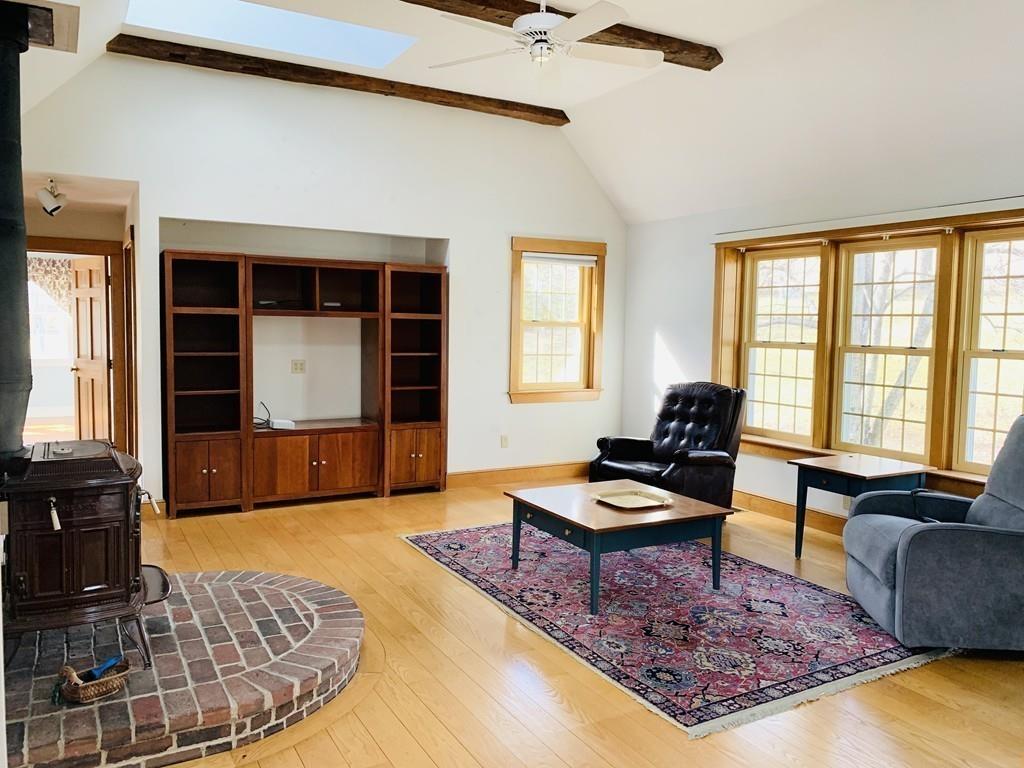 272 Lowell Road Groton, MA 01450 - Photo 9 of 21 a living room with furniture and a rug