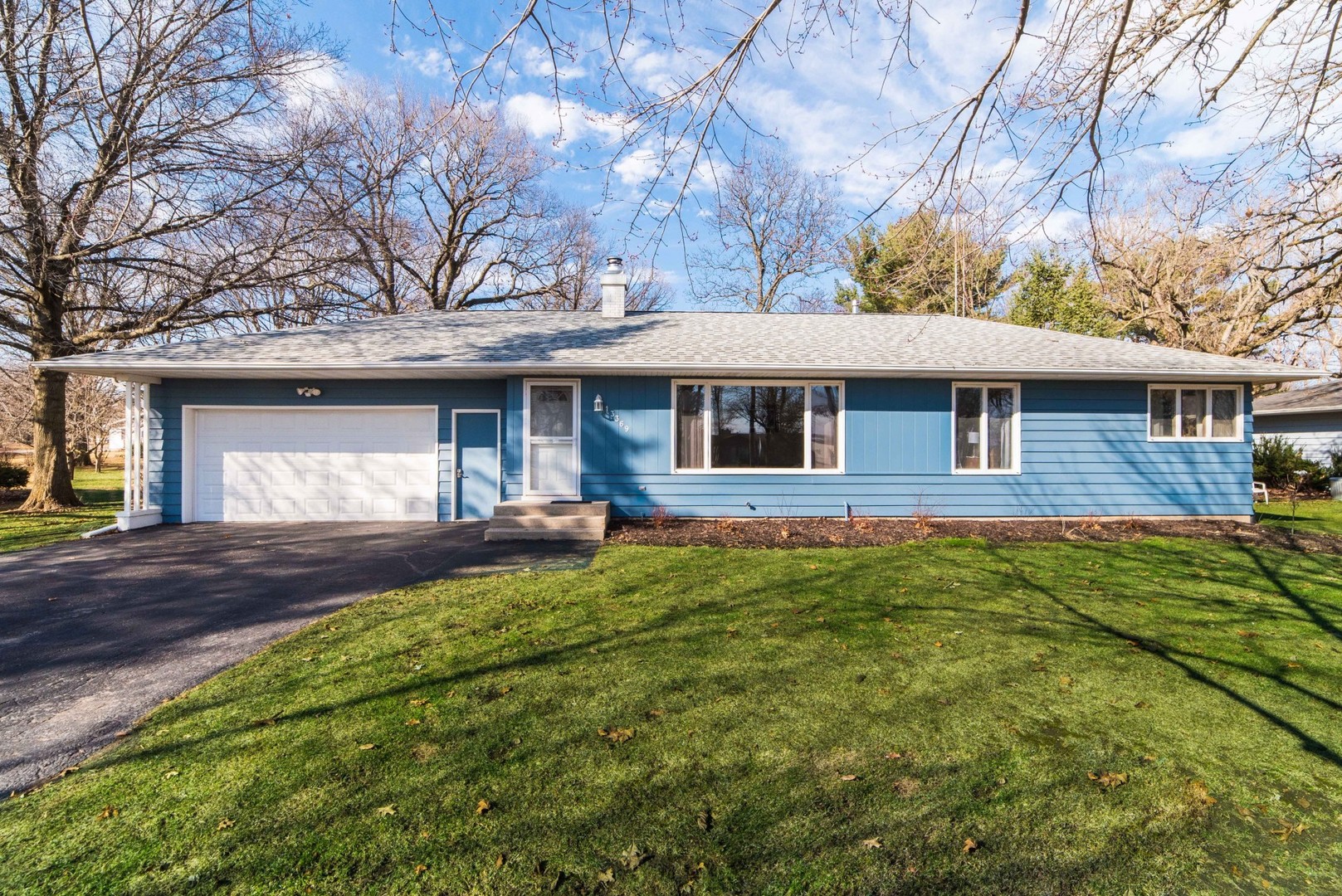 13369 Ash Road Genoa, IL 60135 - Photo 1 of 26 a view of a house with a yard