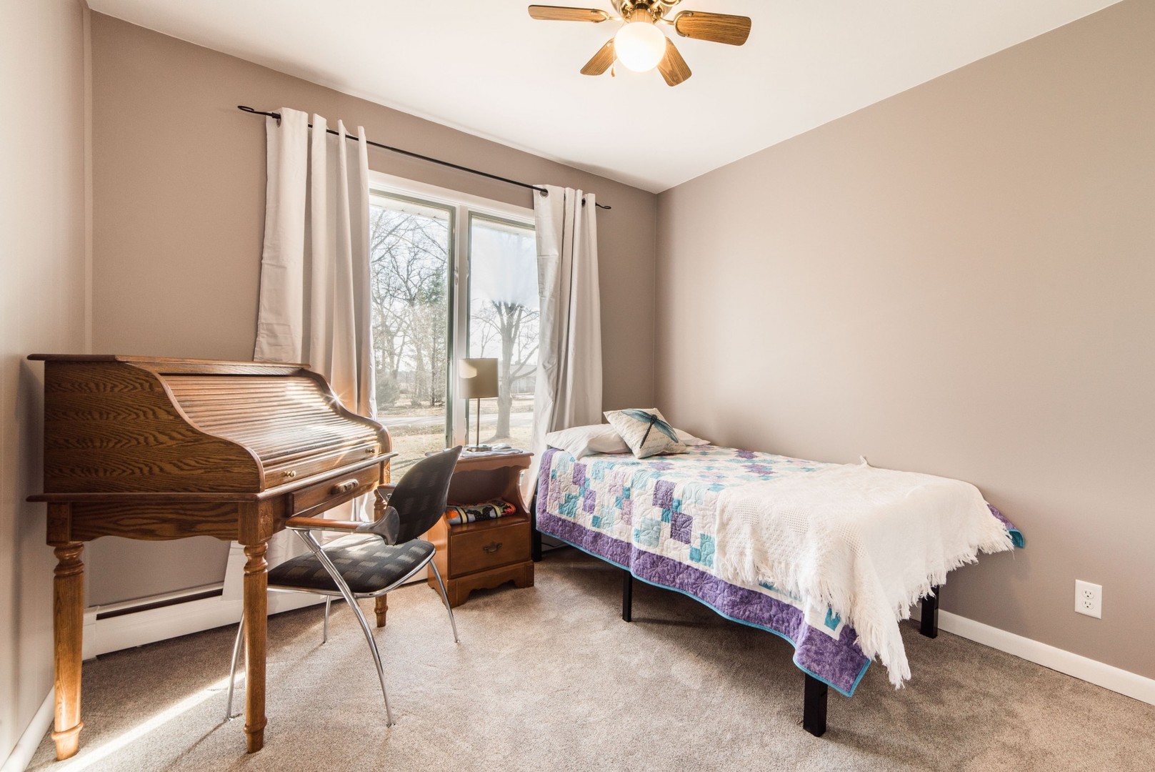 13369 Ash Road Genoa, IL 60135 - Photo 11 of 26 a bedroom with a bed and a chandelier