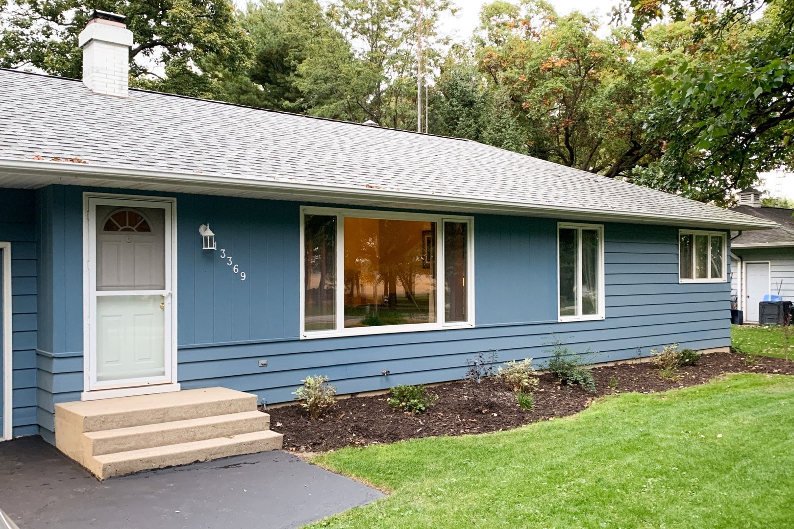 13369 Ash Road Genoa, IL 60135 - Photo 20 of 26 a front view of a house with garden