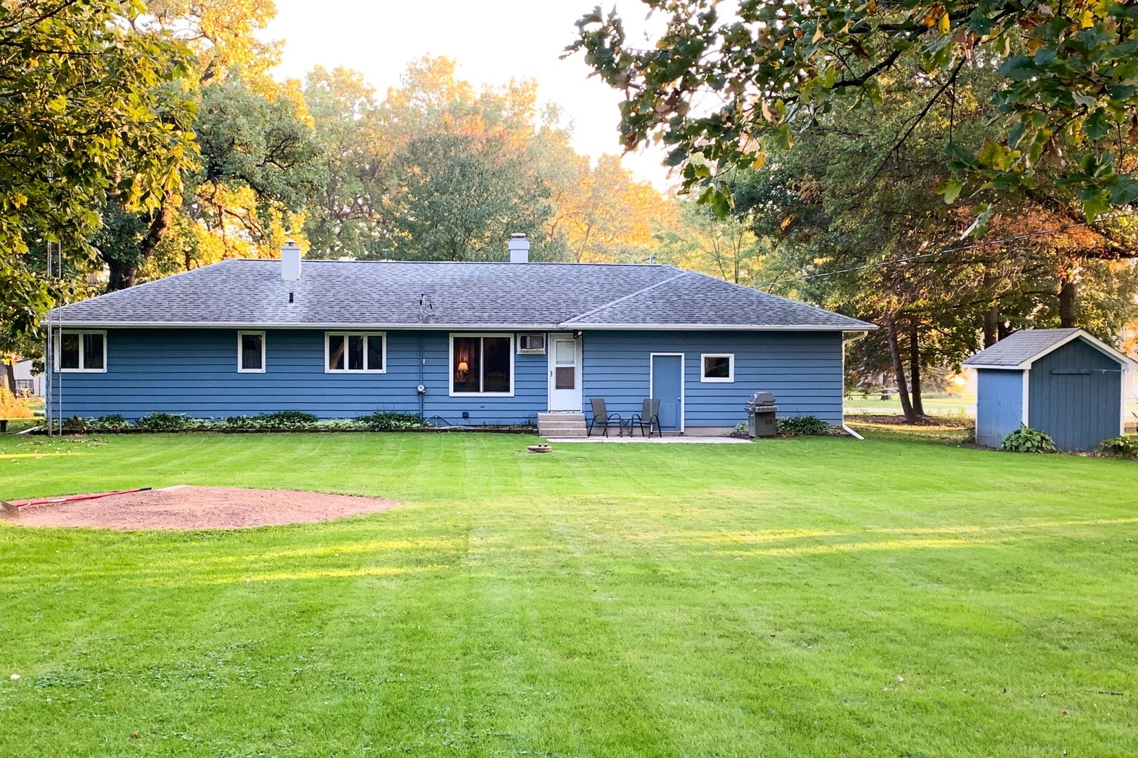 13369 Ash Road Genoa, IL 60135 - Photo 22 of 26 a view of a house with a swimming pool