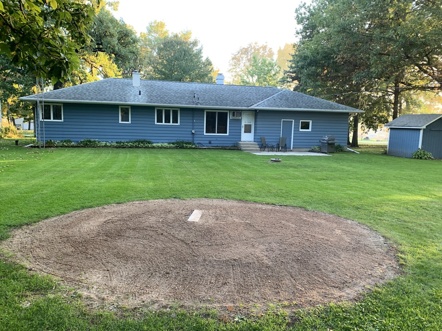 13369 Ash Road Genoa, IL 60135 - Photo 23 of 26 a front view of a house with a garden