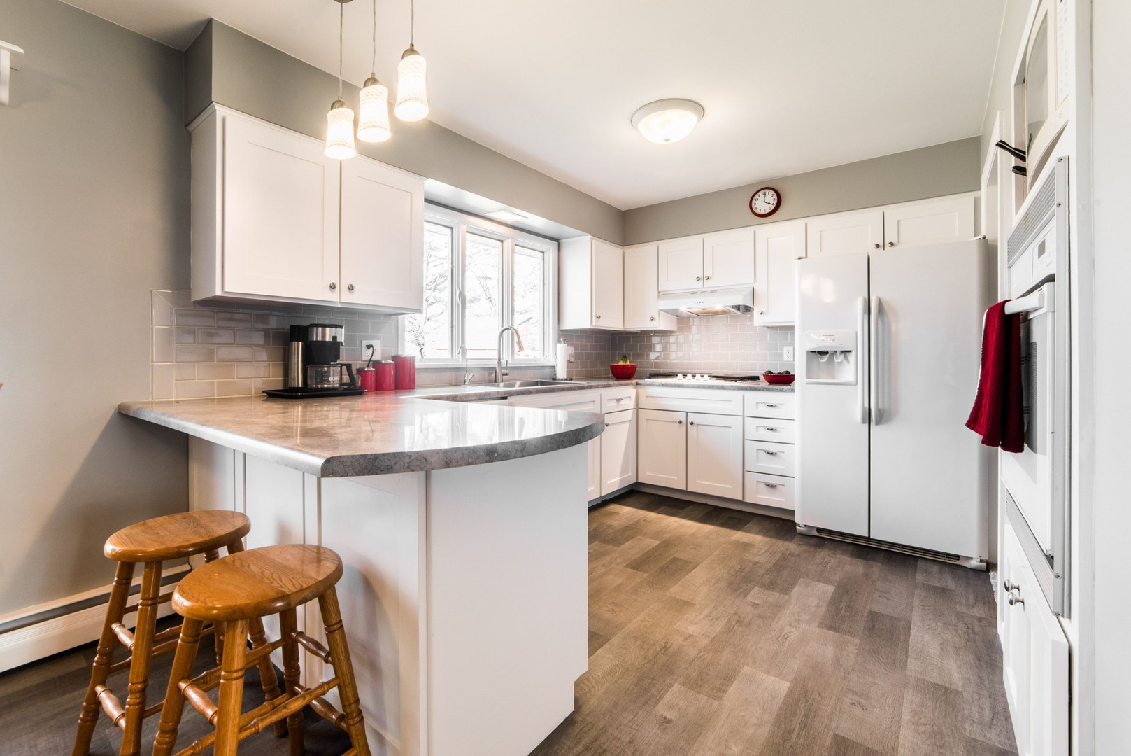 13369 Ash Road Genoa, IL 60135 - Photo 5 of 26 a kitchen with stainless steel appliances cabinets a sink and a window