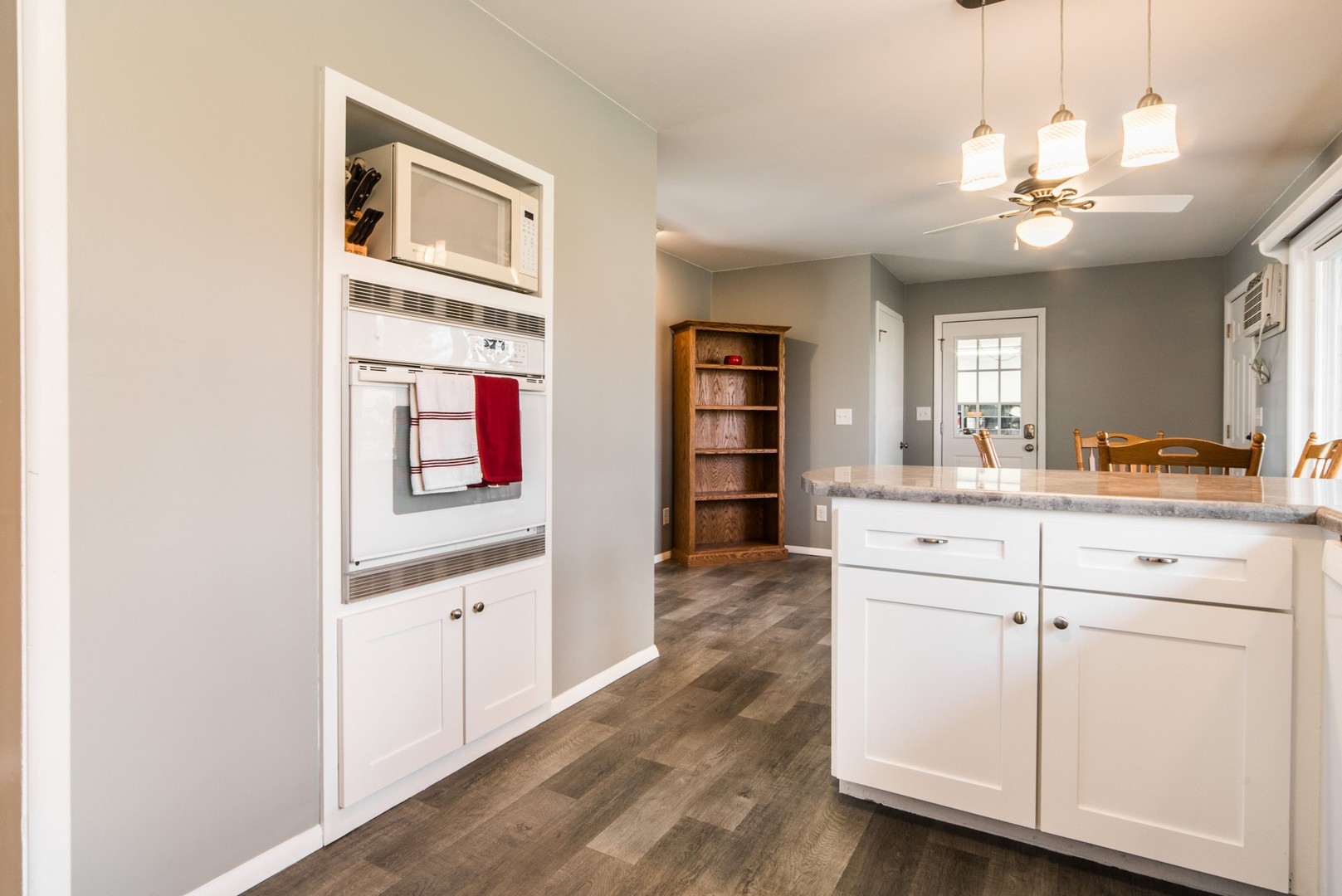 13369 Ash Road Genoa, IL 60135 - Photo 8 of 26 a spacious bathroom with a granite countertop sink a mirror and vanity