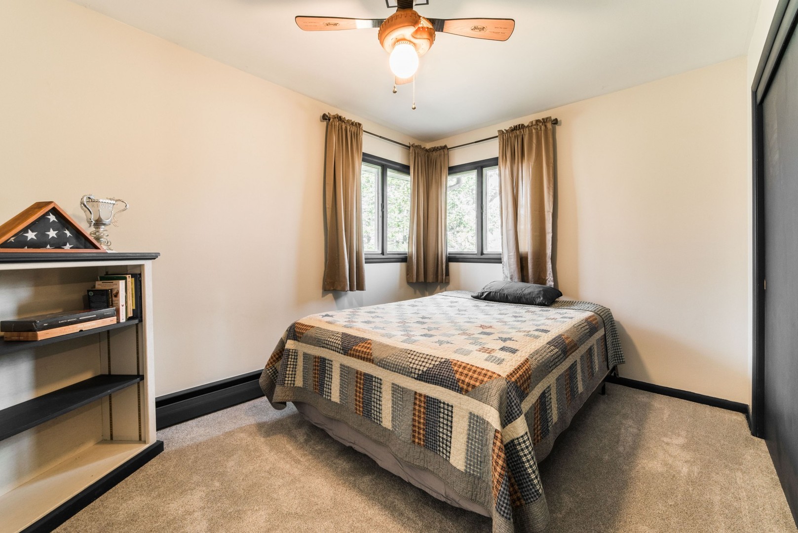 13369 Ash Road Genoa, IL 60135 - Photo 10 of 26 a bedroom with a bed and a chandelier