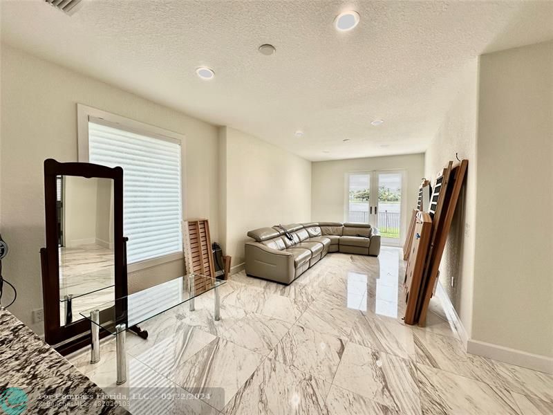 3395 Meadowbrook Way Davie, FL 33328 - Photo 26 of 27 a bed room with a bed and a flat tv screen