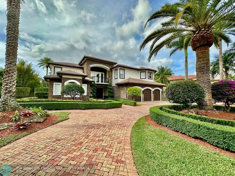 3395 Meadowbrook Way Davie, FL 33328 - Photo 3 of 27 a front view of a house with garden