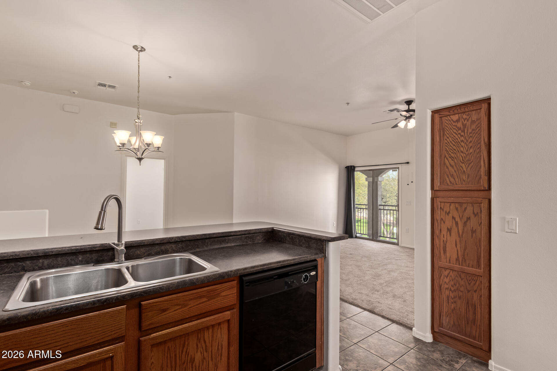 280 South Evergreen Road, Unit 1246 Tempe, AZ 85288 - Photo 11 of 25 a kitchen with a sink and a refrigerator