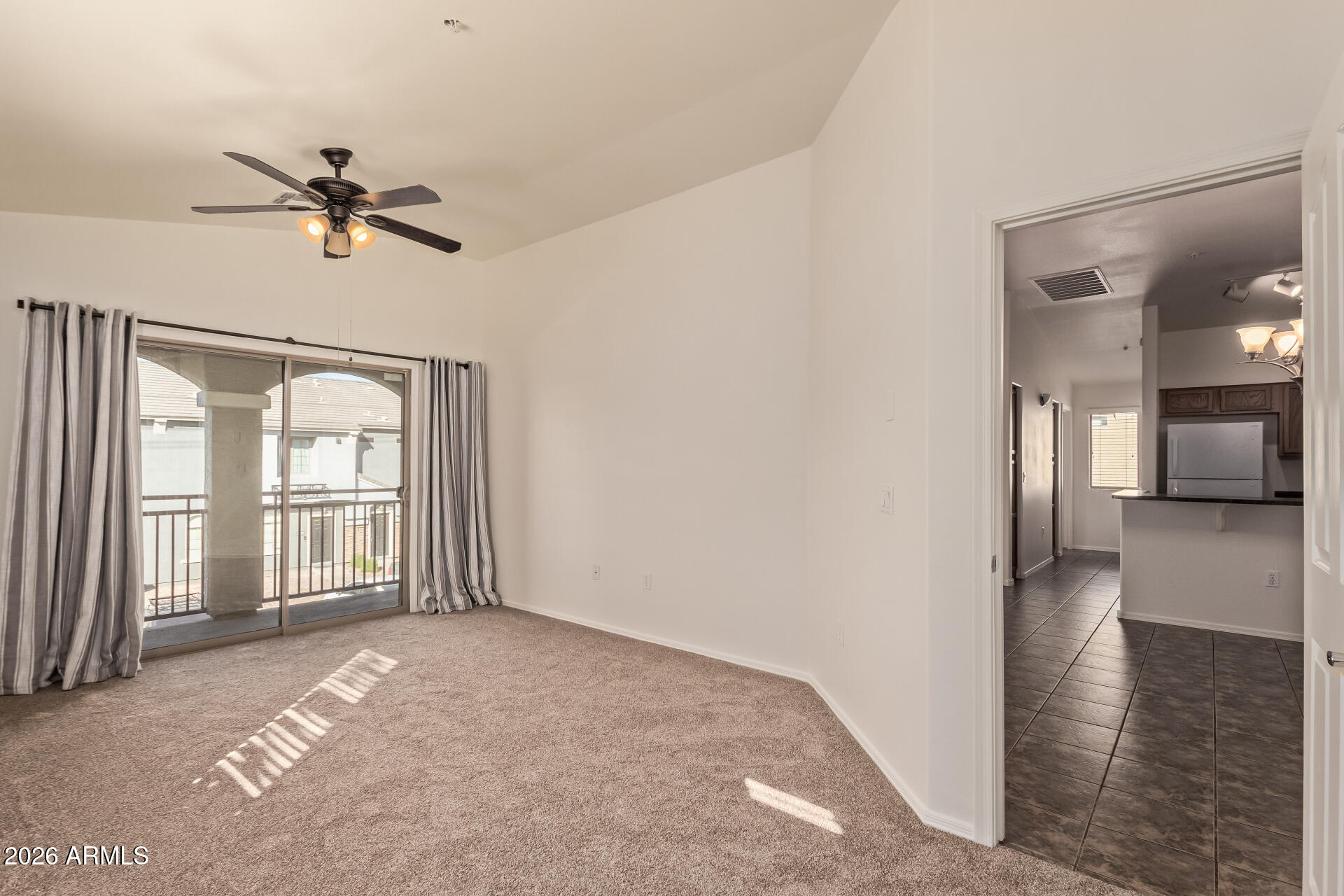 280 South Evergreen Road, Unit 1246 Tempe, AZ 85288 - Photo 16 of 25 a view of a livingroom with a ceiling fan and window