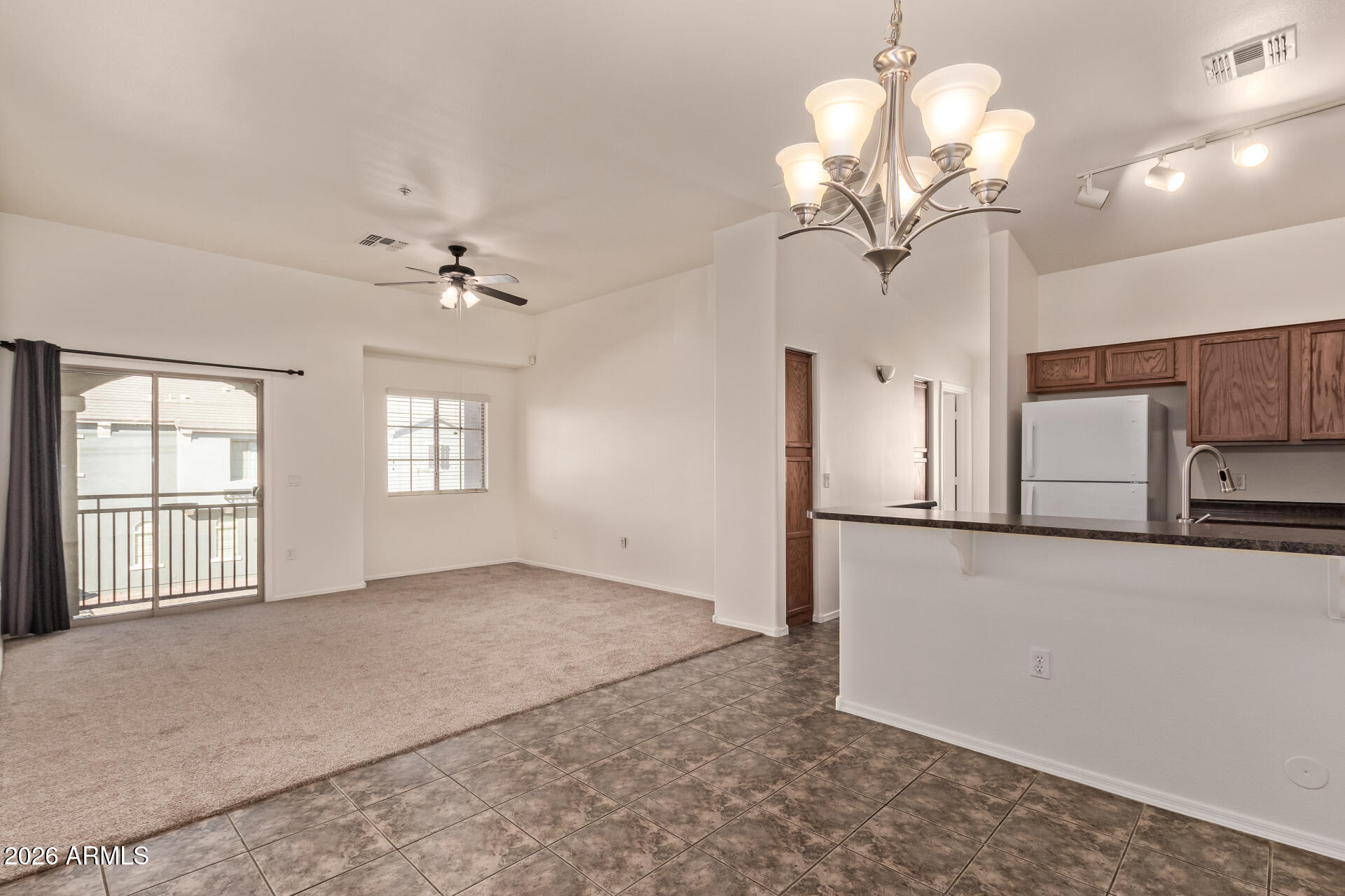 280 South Evergreen Road, Unit 1246 Tempe, AZ 85288 - Photo 9 of 25 a view of a livingroom with a chandelier
