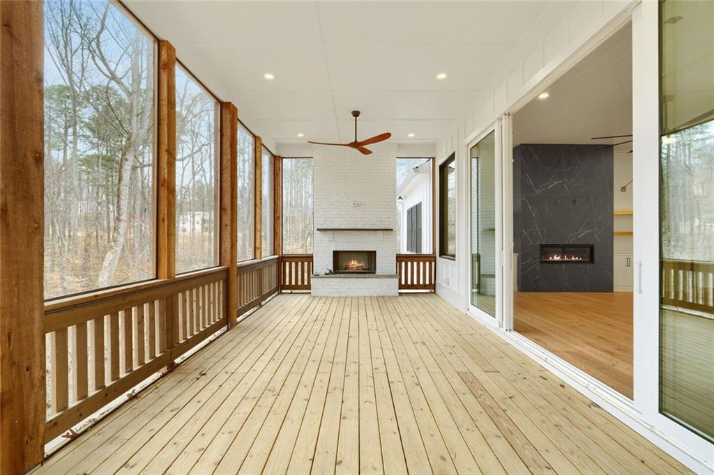 555 Lower Birmingham Road Canton, GA 30115 - Photo 61 of 104 a view of a hallway with wooden floor furniture and a kitchen