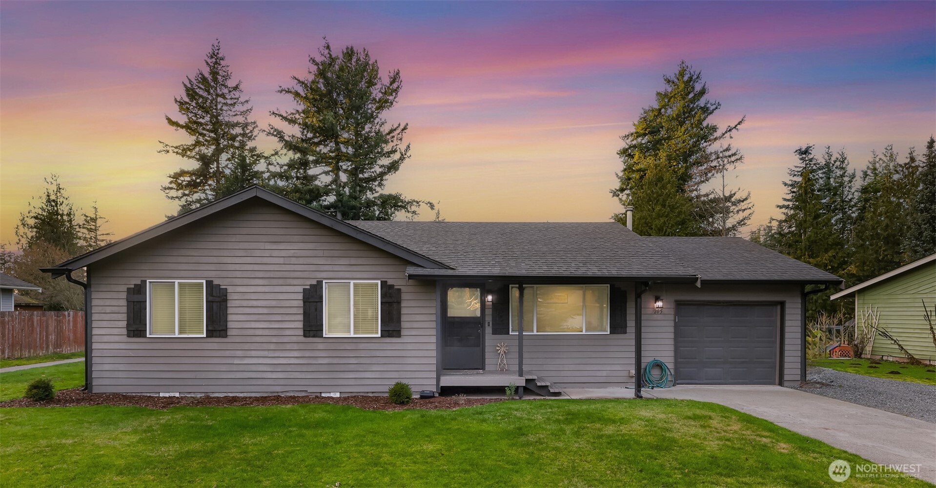 205 Cashmere Lane Everson, WA 98247 - Photo 1 of 40 a front view of a house with a garden