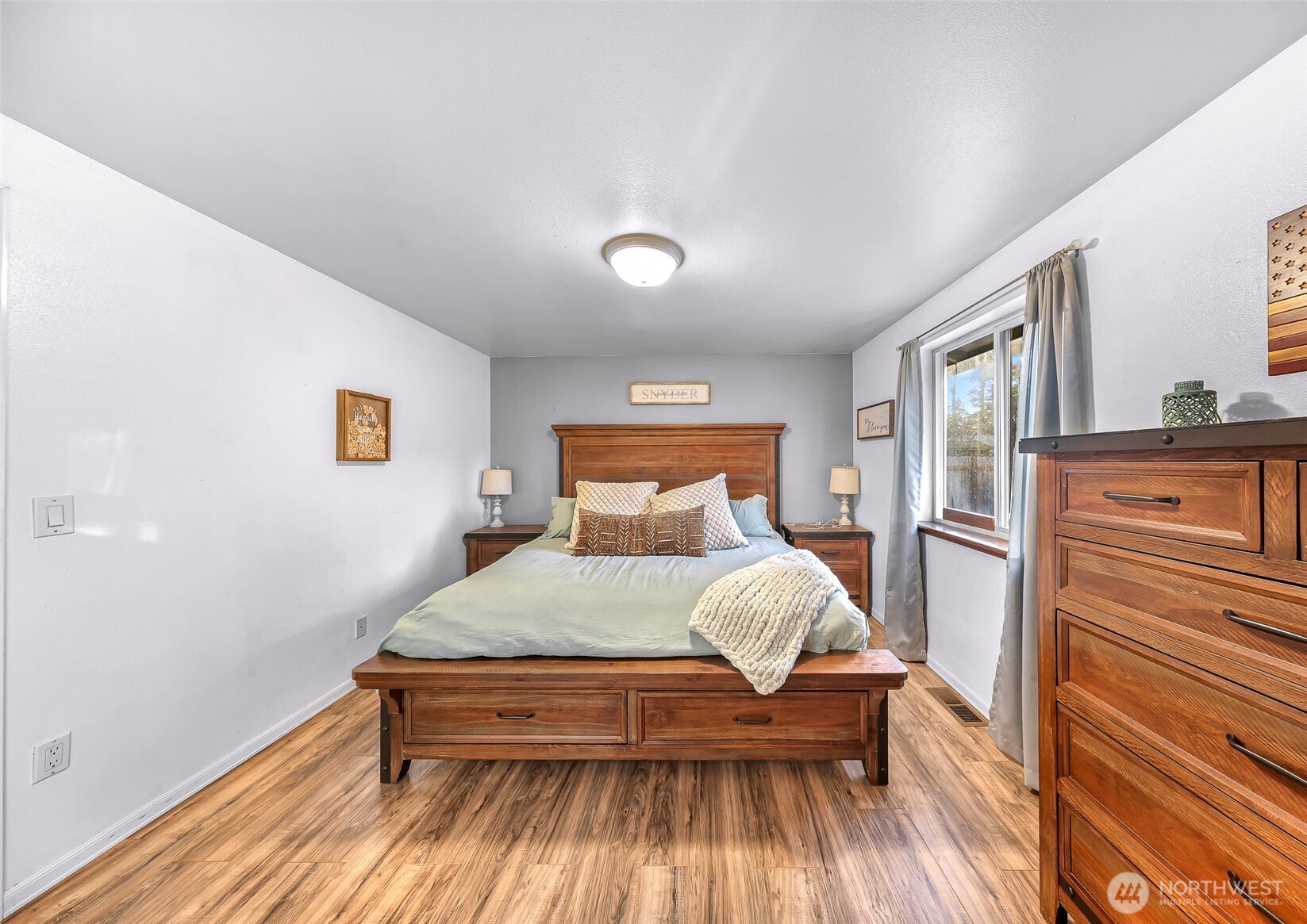 205 Cashmere Lane Everson, WA 98247 - Photo 11 of 40 a bedroom with a bed and wooden floor