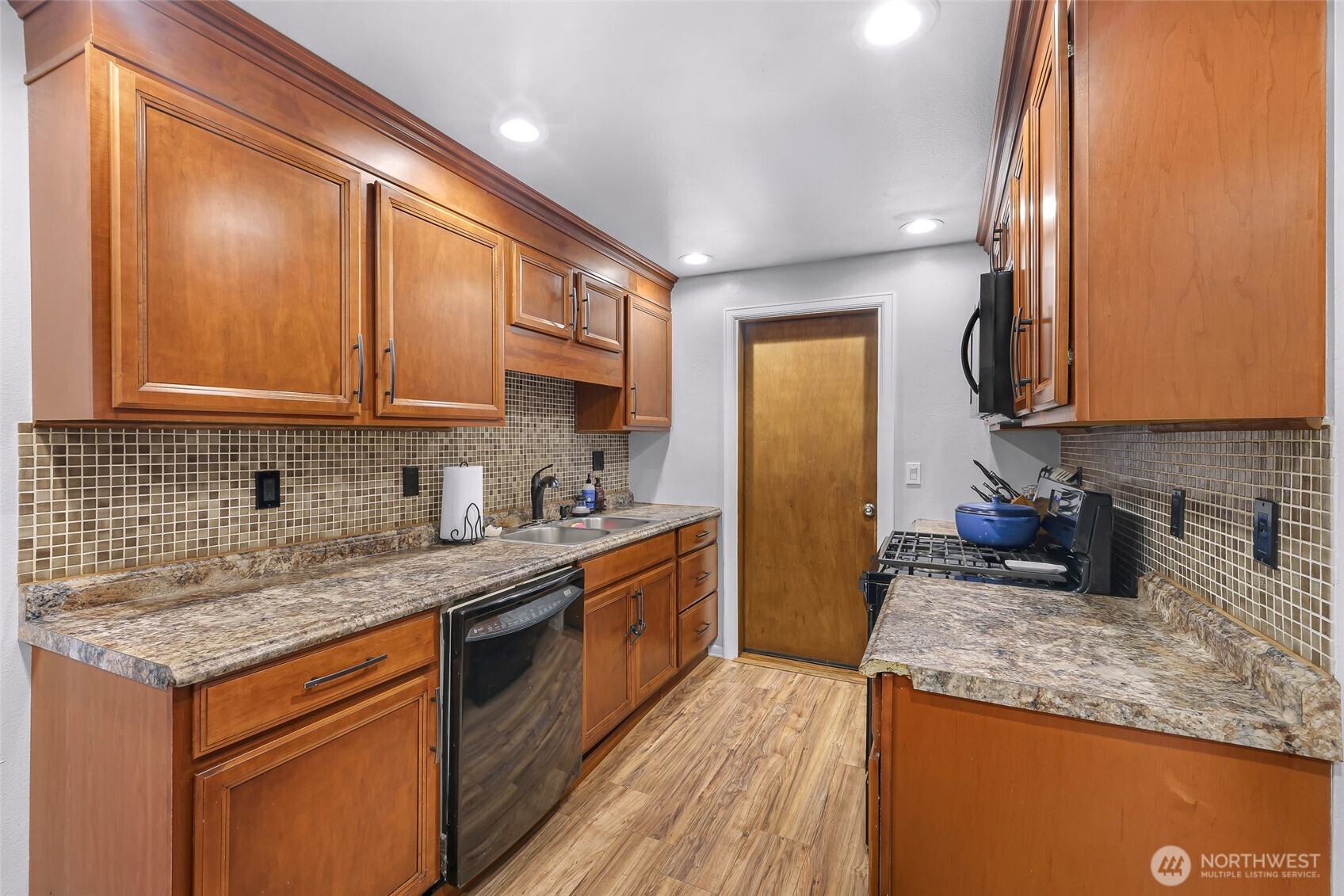 205 Cashmere Lane Everson, WA 98247 - Photo 14 of 40 a kitchen with stainless steel appliances granite countertop a sink stove and refrigerator