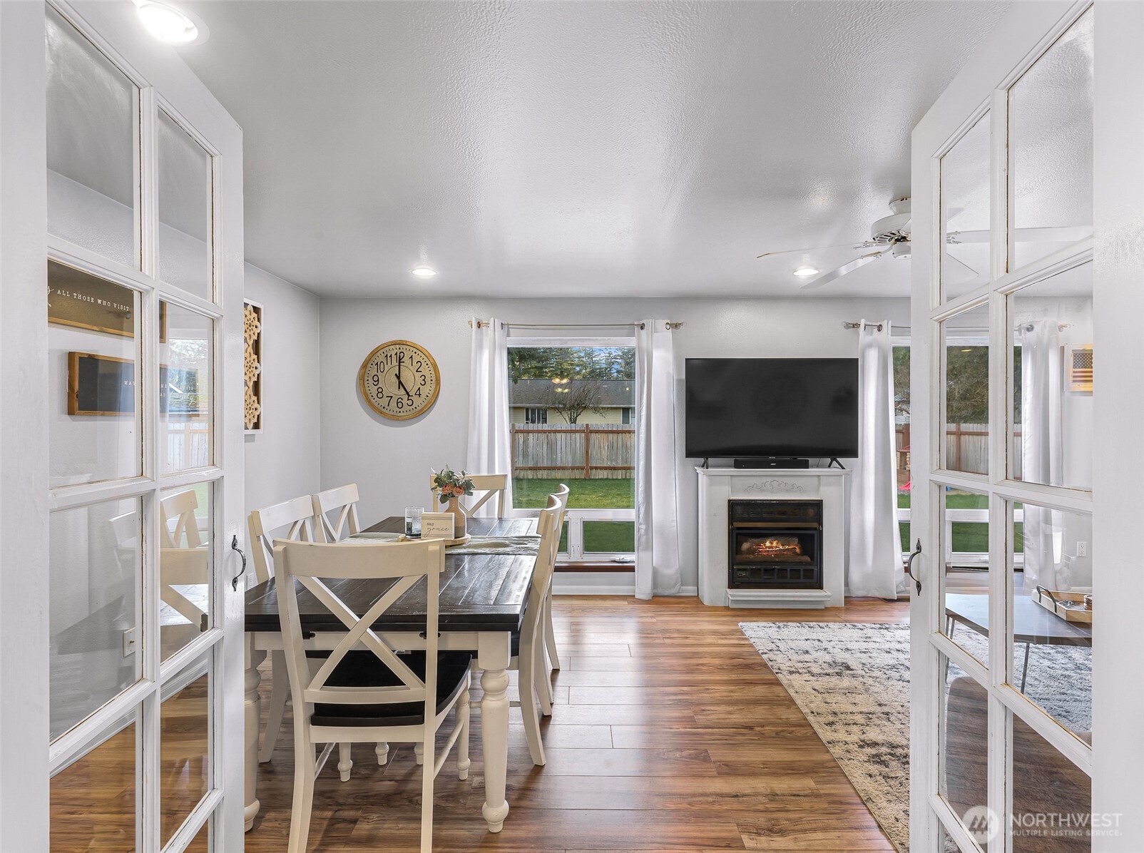 205 Cashmere Lane Everson, WA 98247 - Photo 26 of 40 a dining room with furniture a fireplace and wooden floor