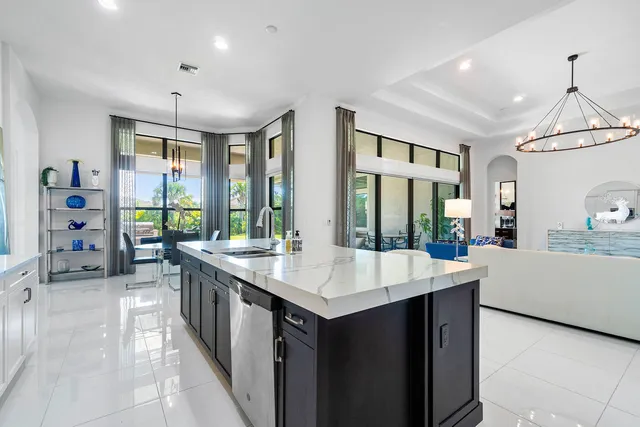 a room with a large window and furniture