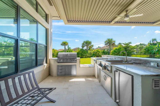 a view of a patio with a table chairs and a patio