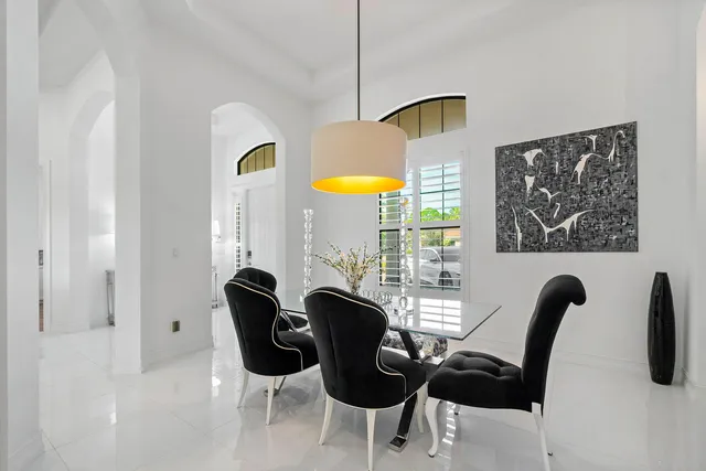 a view of a dining room with furniture and window