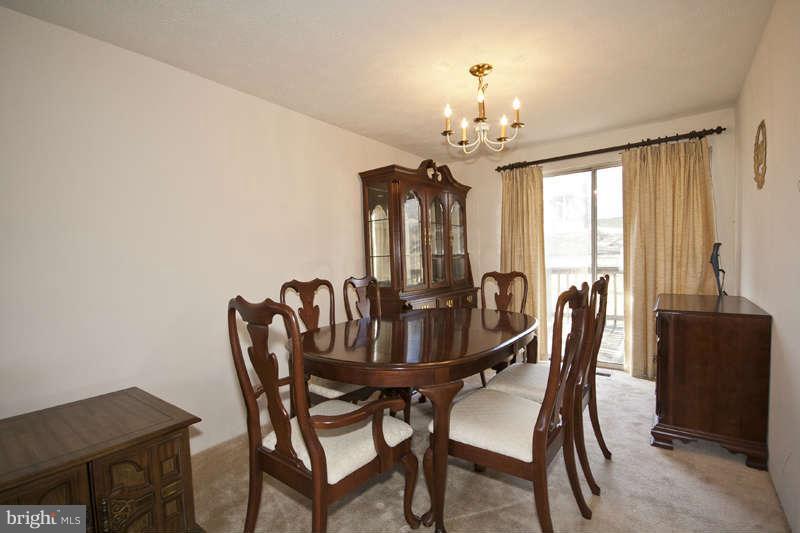 4715 Hawksbury Road Baltimore, MD 21208 - Photo 4 of 15 a view of a dining room with furniture and window