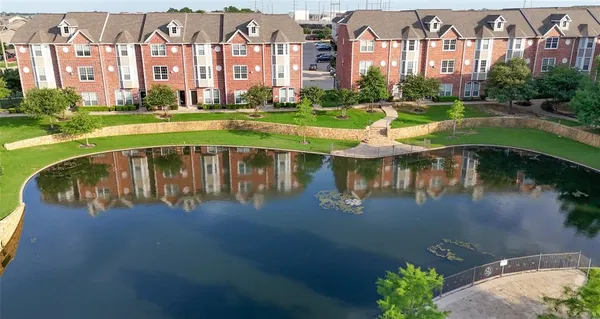a view of a lake with a building in the background