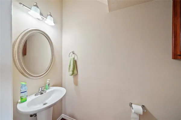 a bathroom with a sink vanity and a mirror