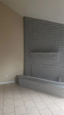 an empty room that has a window in it