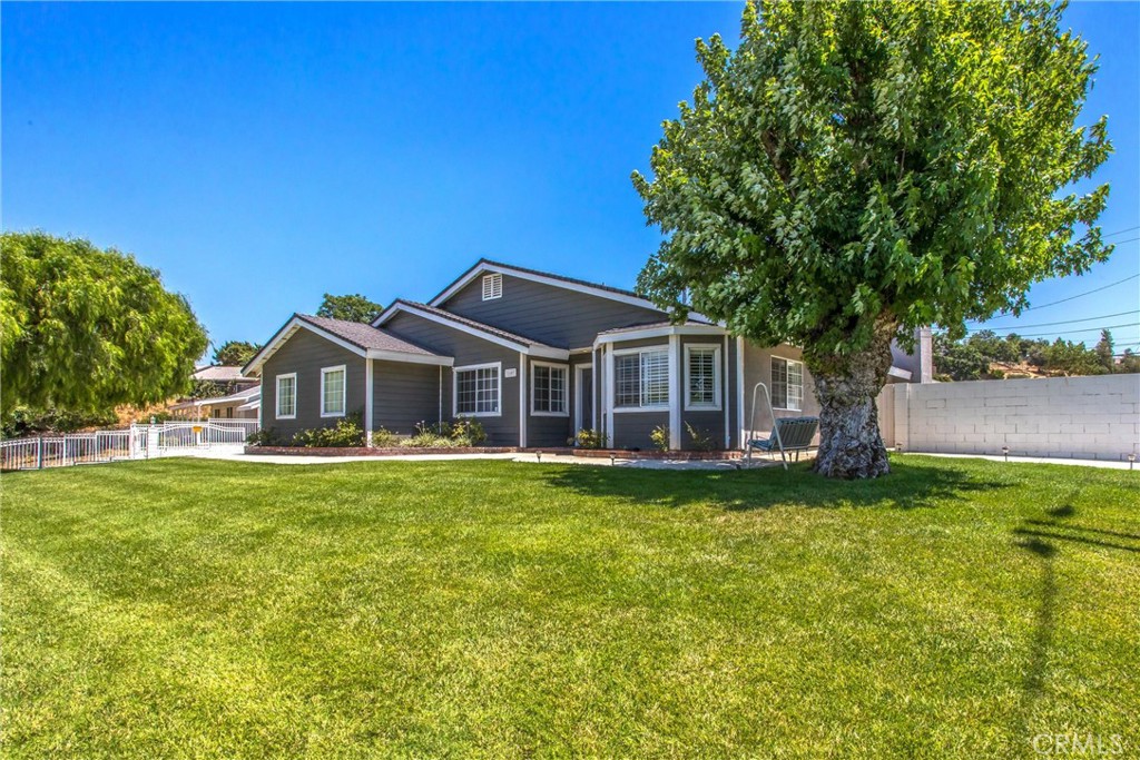 31607 Florida Street Redlands, CA 92373 - Photo 1 of 65 a front view of a house with a garden