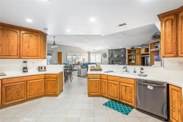 a bathroom with a granite countertop sink mirror toilet and bathtub