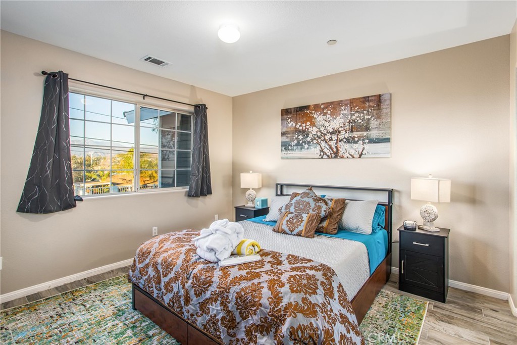 31607 Florida Street Redlands, CA 92373 - Photo 18 of 65 a bedroom with a bed and a window