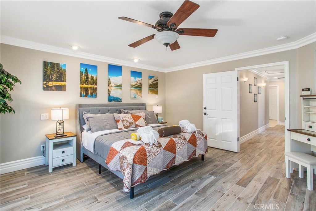 31607 Florida Street Redlands, CA 92373 - Photo 24 of 65 a bedroom with a bed and a ceiling fan