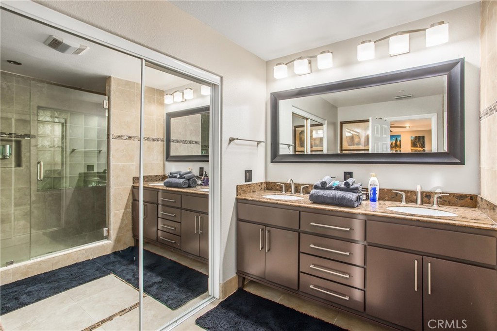 31607 Florida Street Redlands, CA 92373 - Photo 26 of 65 a bathroom with a granite countertop sink mirror and double