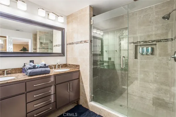 a view of a patio with table and chairs and potted plants