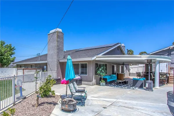a view of a house with swimming pool and porch